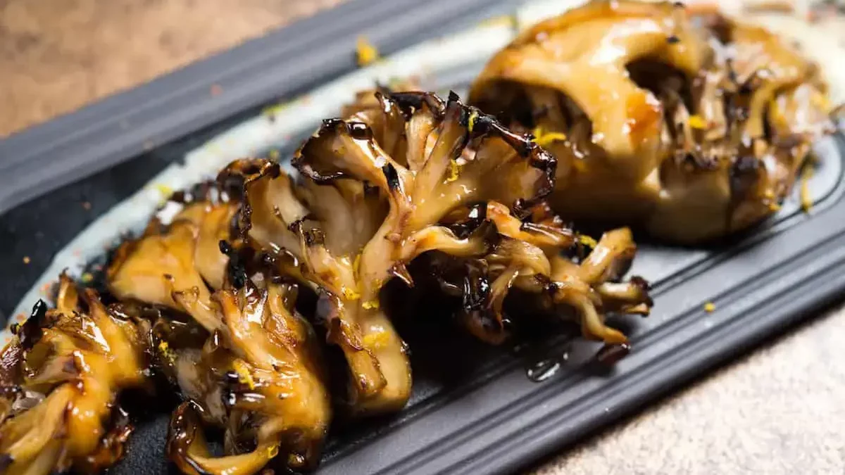 Grilled maitake mushrooms on plate
