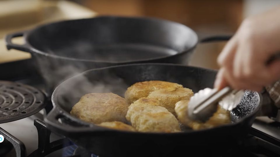 lion's mane mushrooms cooking in a hot pan